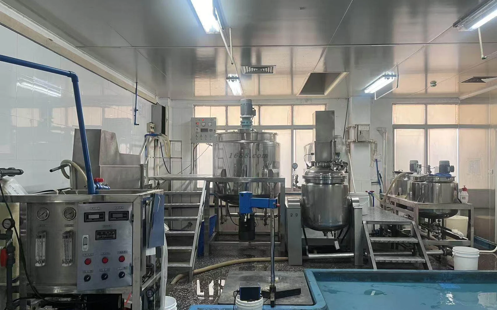 Stainless-steel processing equipment in the Sandio Cosmetics production room